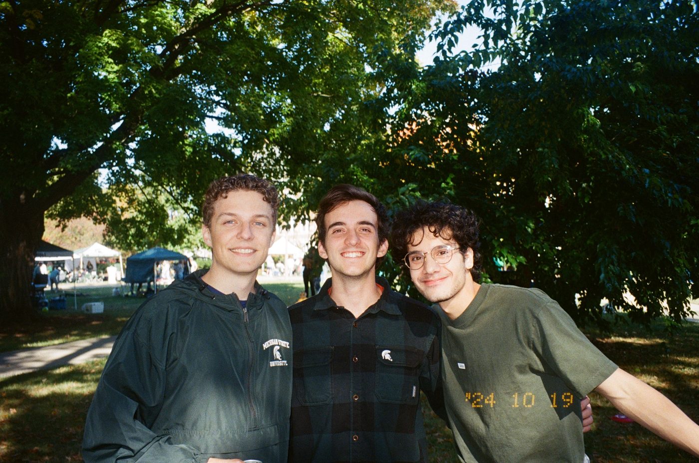 With friends outdoors under a tree
