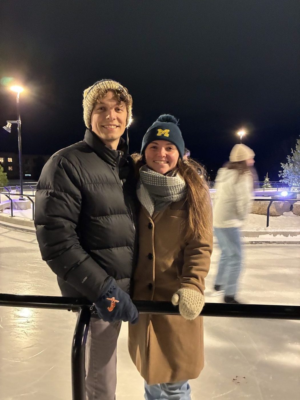 Ice skating outdoors on a winter evening