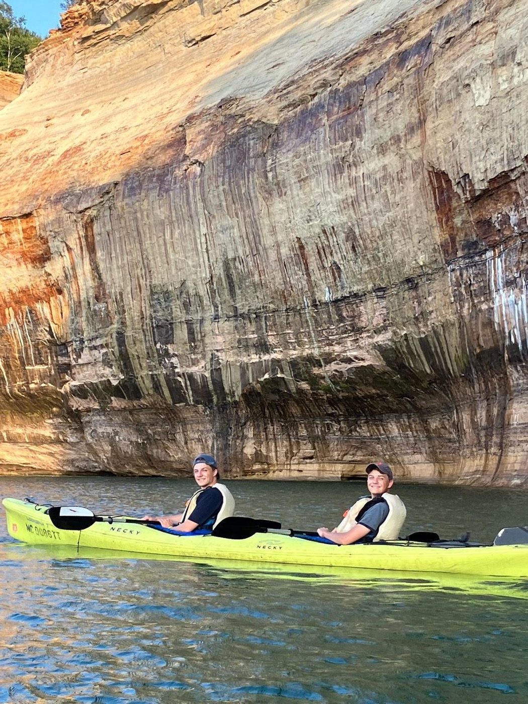 Kayaking past the cliffs at Pictured Rocks National Lakeshore